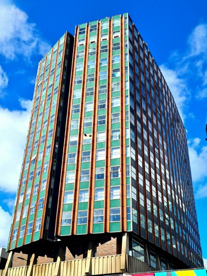 A 1960s Modern style high rise university building.