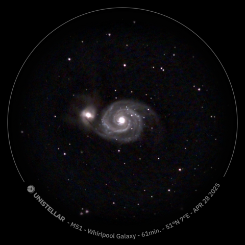 Image of the Whirlpool Galaxy, a spiral galaxy in the center of the image, with another smaller galaxy to its left. The background is dark with scattered individual stars.