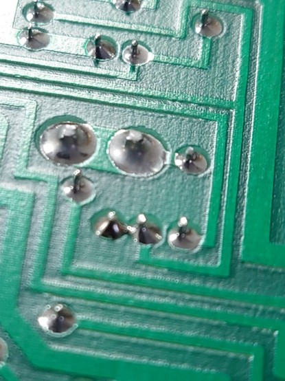 A solder bridge between 2 pins, R7 and R6 which is present as a connection in the schematic.