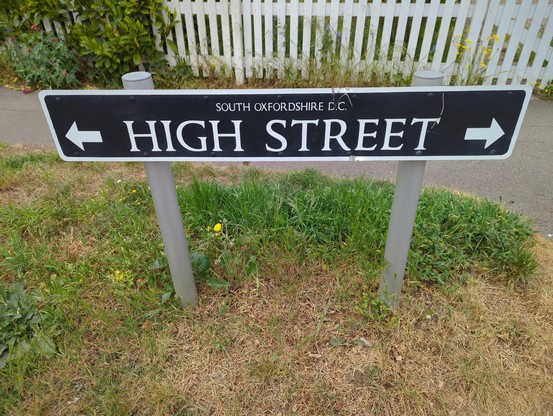 White on black street sign in Oxfordshire