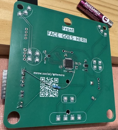The front side of the PCB badge. One can see the different LEDs and individual components.