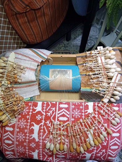 Bobbin lace pillow and beginning of lace