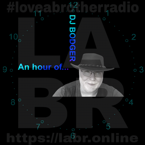 Black Background. LABR Logo in deep dark grey. #lloveabrotherradio on top. https://labr.online on the bottom.  A army green colored clock with numbers and dots covering the entire image. The hand set at 9 o'clock is the short hand and the hand is made out of the name of the show. "And hour of..." The min. hand set at the 12 and is made out of his name. DJ Bodger. A black & white picture of DJ Bodger. White British male with glasses, wearing an Aussie.  cowboy hat. Grey manicured beard. Black t-shirt