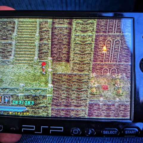 PSP displaying a game
A character is looking at a chess far away at the other side of a chasm