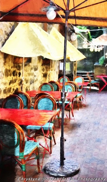 2017- A photo painting of an outdoor cafe with large umbrellas to offer shade during the day and a string of lights to illuminate the cozy seating area at night. Sit a spell at Café des Rêveries (Cafe of Daydreams), where the food and drink will nourish your thoughts as the creative muse visits. Take a sip of afternoon coffee or enjoy a glass of wine to accompany a late dinner and who knows - mayhap the next literary or artistic masterpiece will be called forth. Many a time in the past authors and artists have frequented cafes or restaurants as places where their creative minds opened to write a novel or paint - Picasso, Hemingway, Pushkin, Kafka, and Rowling are just some of the recognized names that would seek out places to dine and create. I saw this cafe and I instantly thought about those cafe's that inspired the literary world.