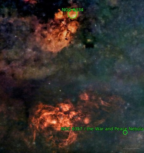 Two red-orange nebulosities against  a fainter blue-green cloudiness. The top nebula resembles the pawprint of a cat, while the lower looks a bit like a lobster or scorpion. Each is annotated in green, with the top labelled "Cats Paw Nebula NGC6334", and the lower "War and Peace Nebula NGC6357".