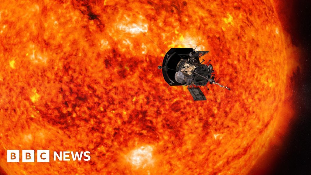 Artist's impression of Parker Solar Probe spacecraft flying past the Sun, which appears bright orange, yellow, brown and black and is substantially larger than the spacecraft in the foreground.
