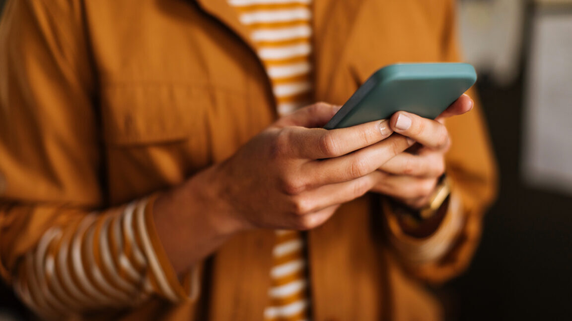 Image of a woman holding a phone