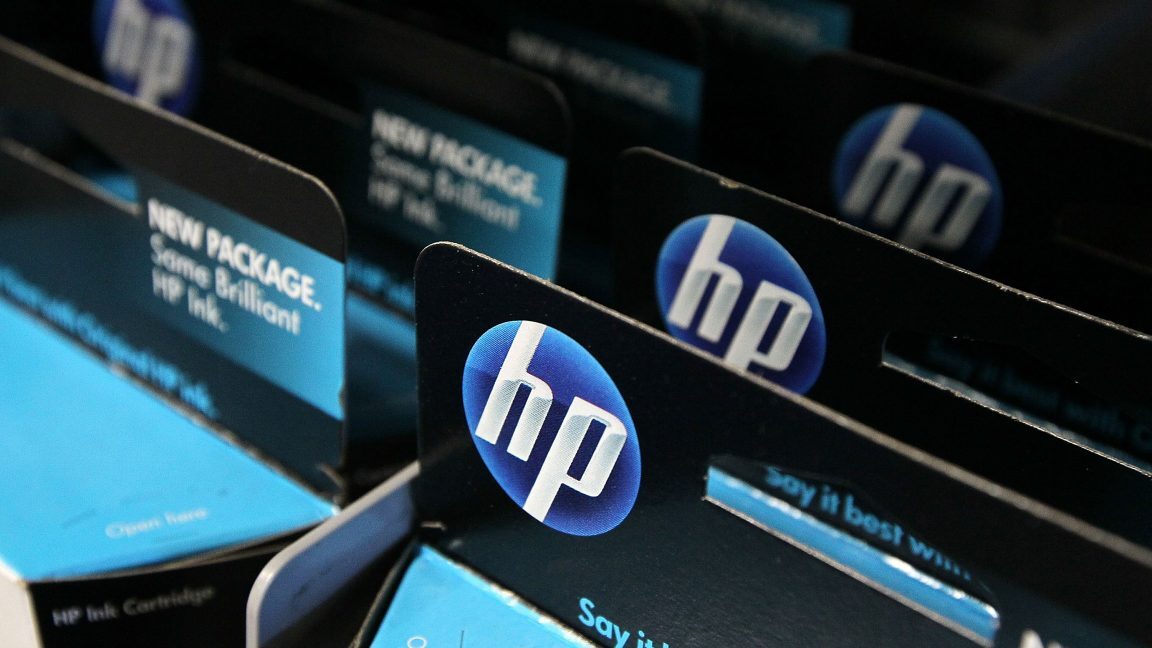 Packages of HP ink cartridges ares displayed at a Best Buy store