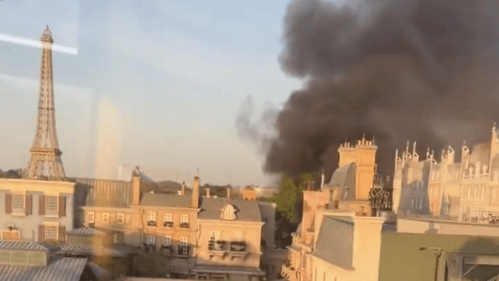 An aerial view of black smoke over Epcot.