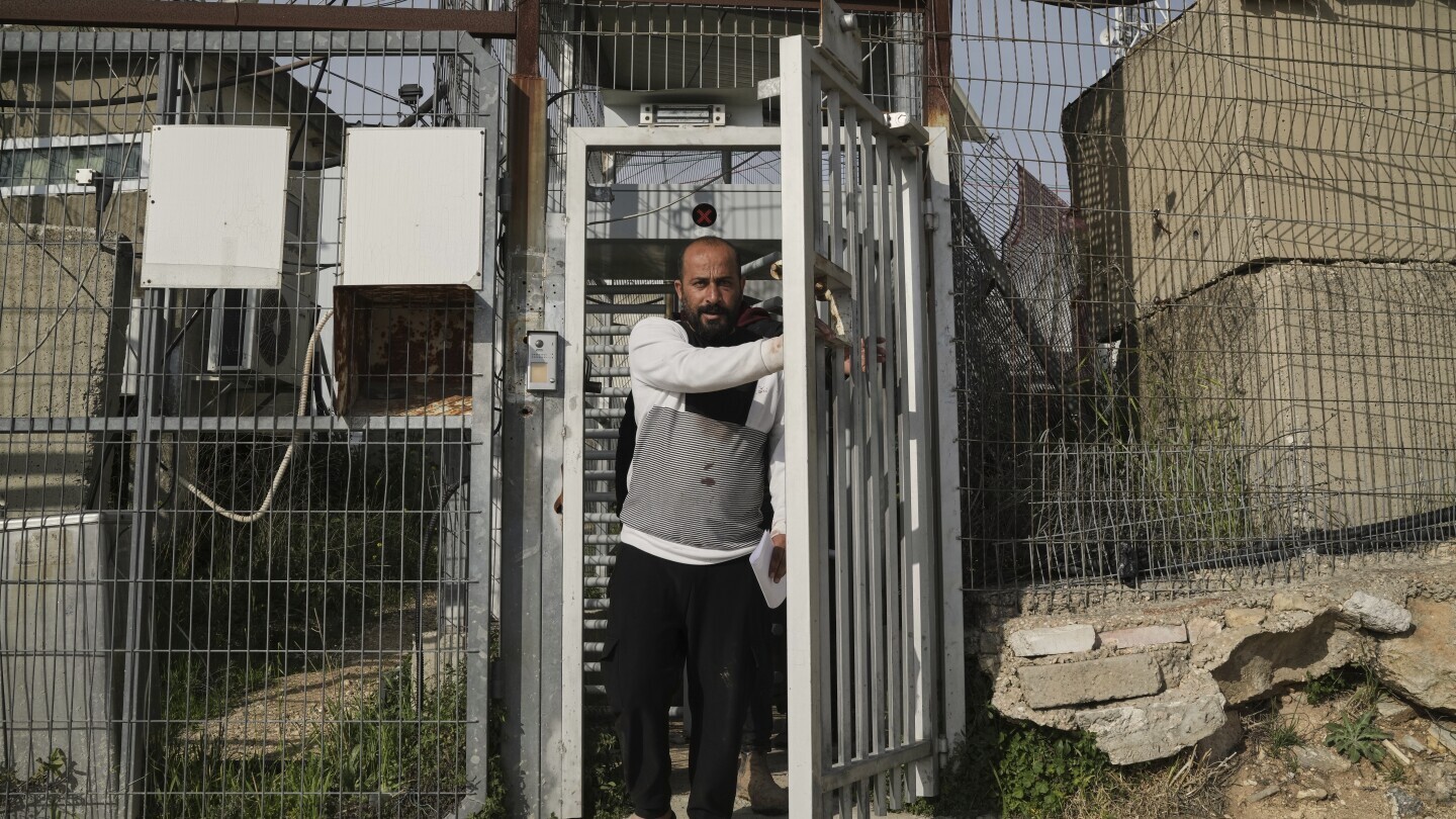 Hamdan Ballal, Oscar-winning Palestinian director of "No Other Land," is released from a police station in the West Bank settlement of Kiryat Arba a day after being detained by the Israeli army following an attack by Jewish settlers, March 25, 2025. (AP Photo/Leo Correa) Hamdan Ballal, Oscar-winning Palestinian director of "No Other Land," is released from a police station in the West Bank settlement of Kiryat Arba a day after being detained by the Israeli army following an attack by Jewish settlers, March 25, 2025. (AP Photo/Leo Correa)