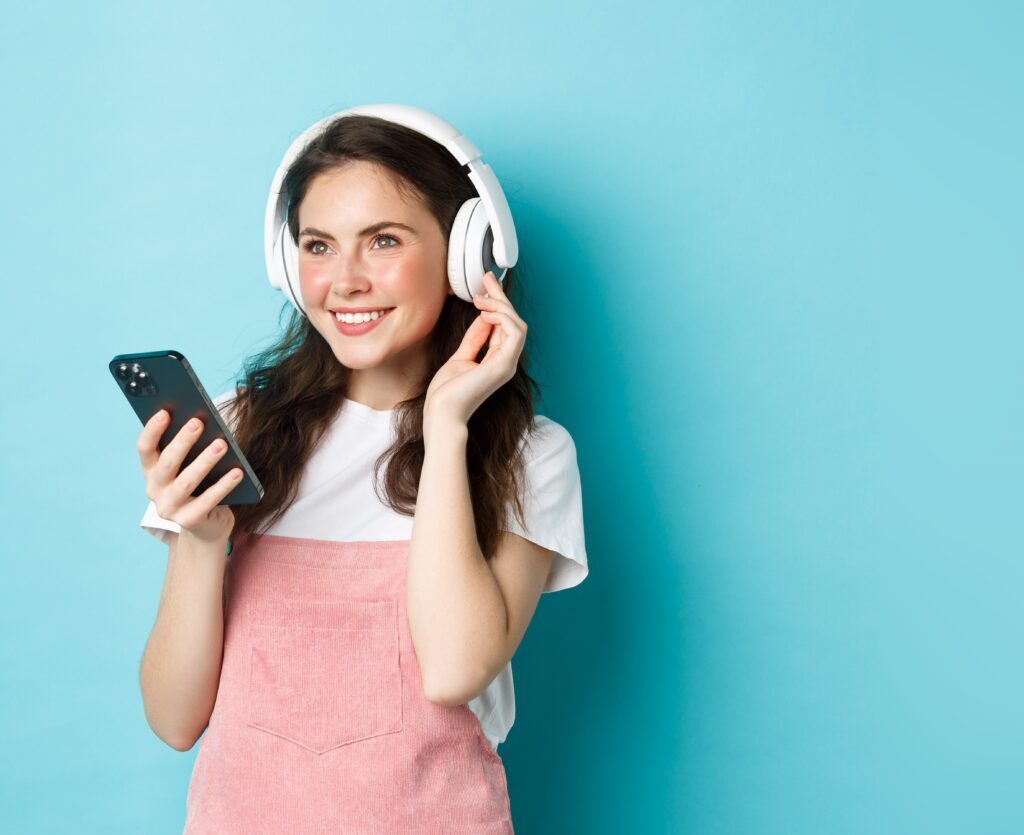 stylish brunette girl headphones holding