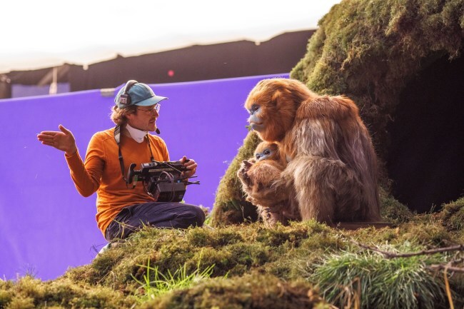 THE LEGEND OF OCHI, director Evan Prosofsky, with Ochi, on set, 2025. © A24 /Courtesy Everett Collection