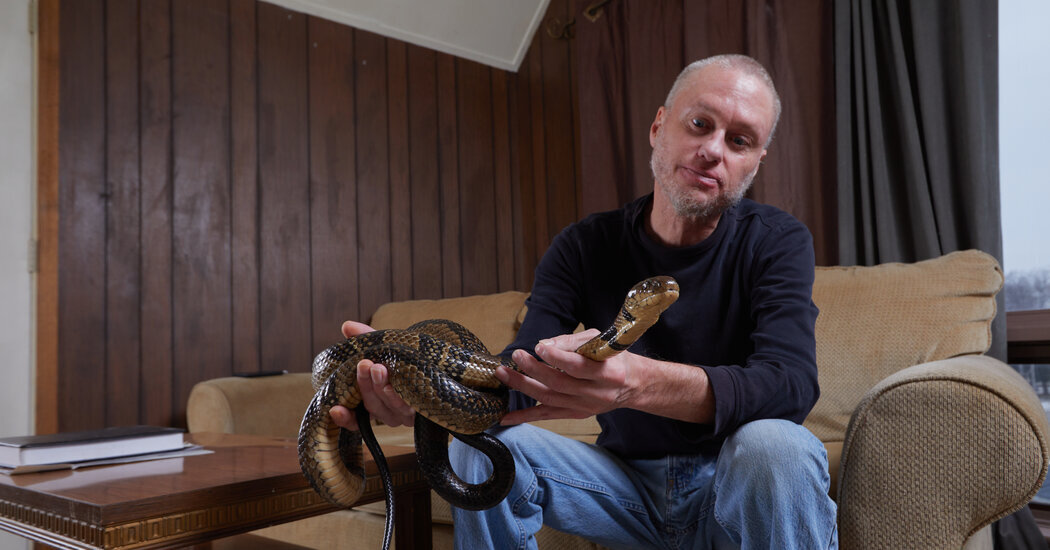 Tim Friede at home in Wisconsin with a snake.