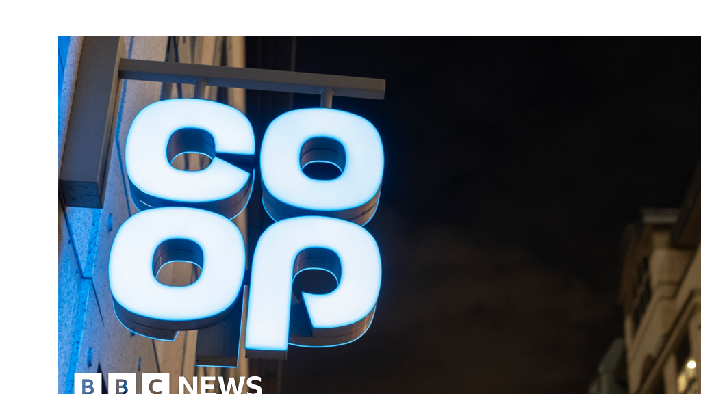 Co-op sign lit up at night in London