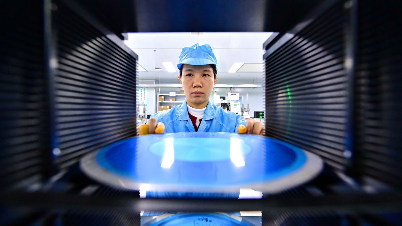 An employee packages semiconductor power devices for export at a semiconductor manufacturing enterprise. An employee packages semiconductor power devices for export at a semiconductor manufacturing enterprise.
