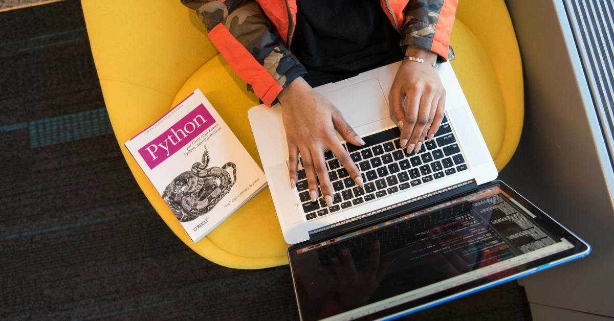 woman programming on a notebook woman programming on a notebook