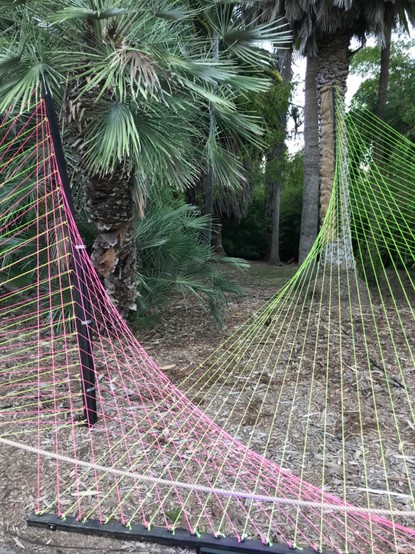 String art surfaces made from yellow and red string