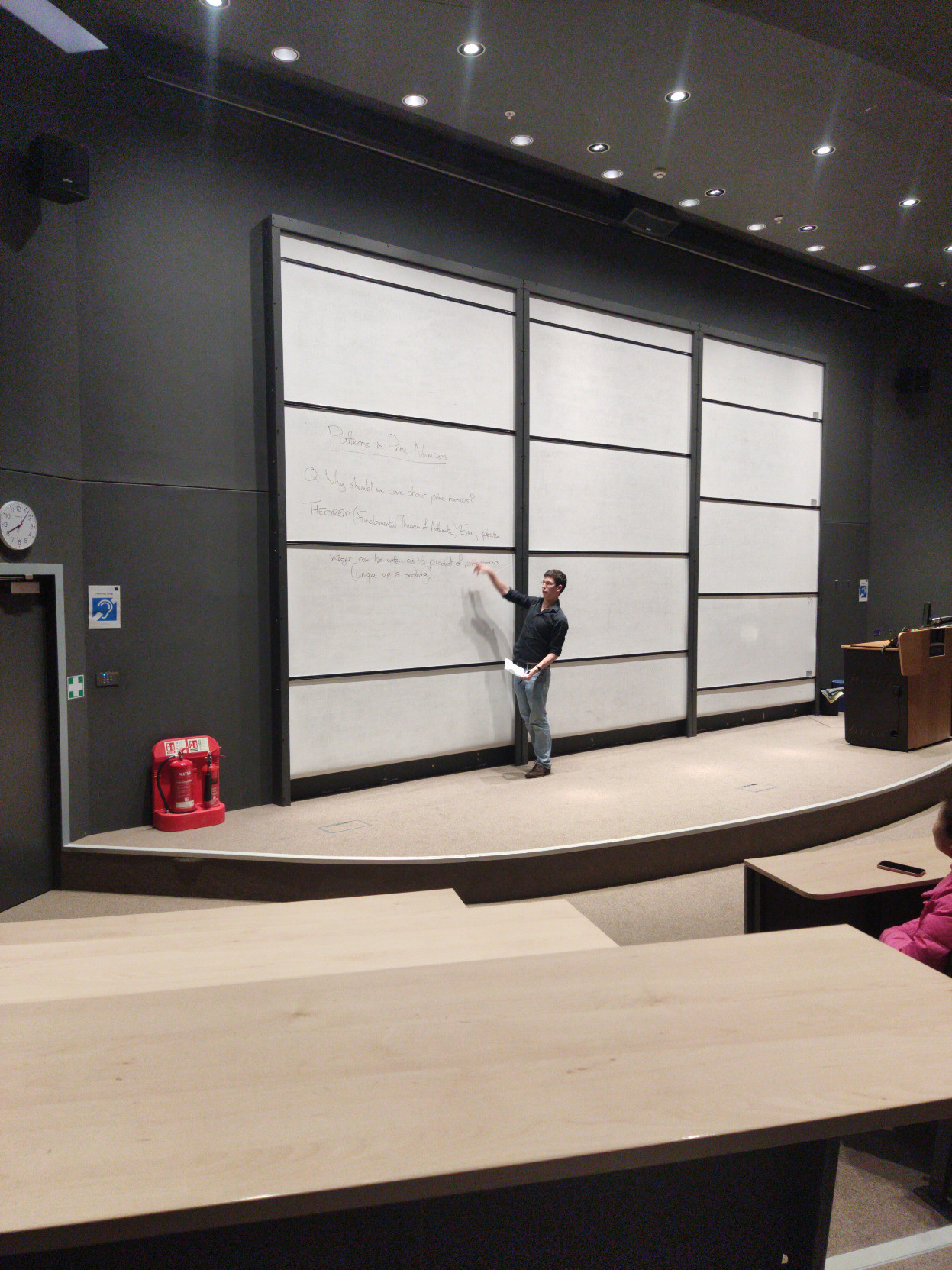 James Maynard in front of the Maths Institute Whiteboards at Oxford University