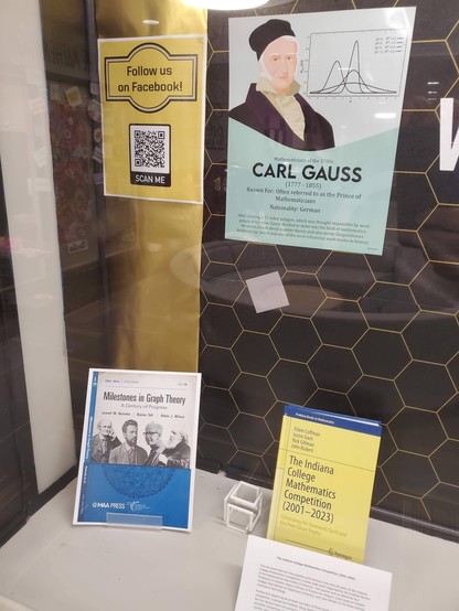 "Milestones in Graph Theory - A Century of Progress" - blue cover art different from the 5-person image on the web site