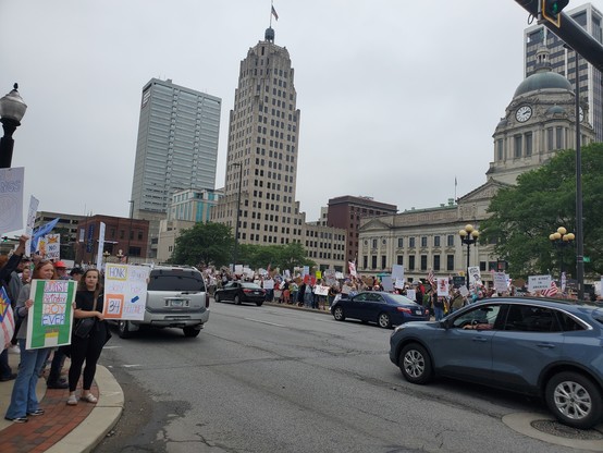 Thousands of people surrounding the courthouse and lining the streets with signs.  Lots of joy and honks