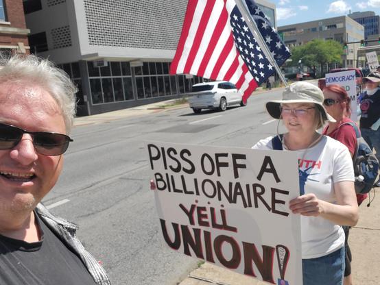 Selfie (with permission) with some signs getting honks on a busy downtown street.  Another photo in the album features Sen. Banks