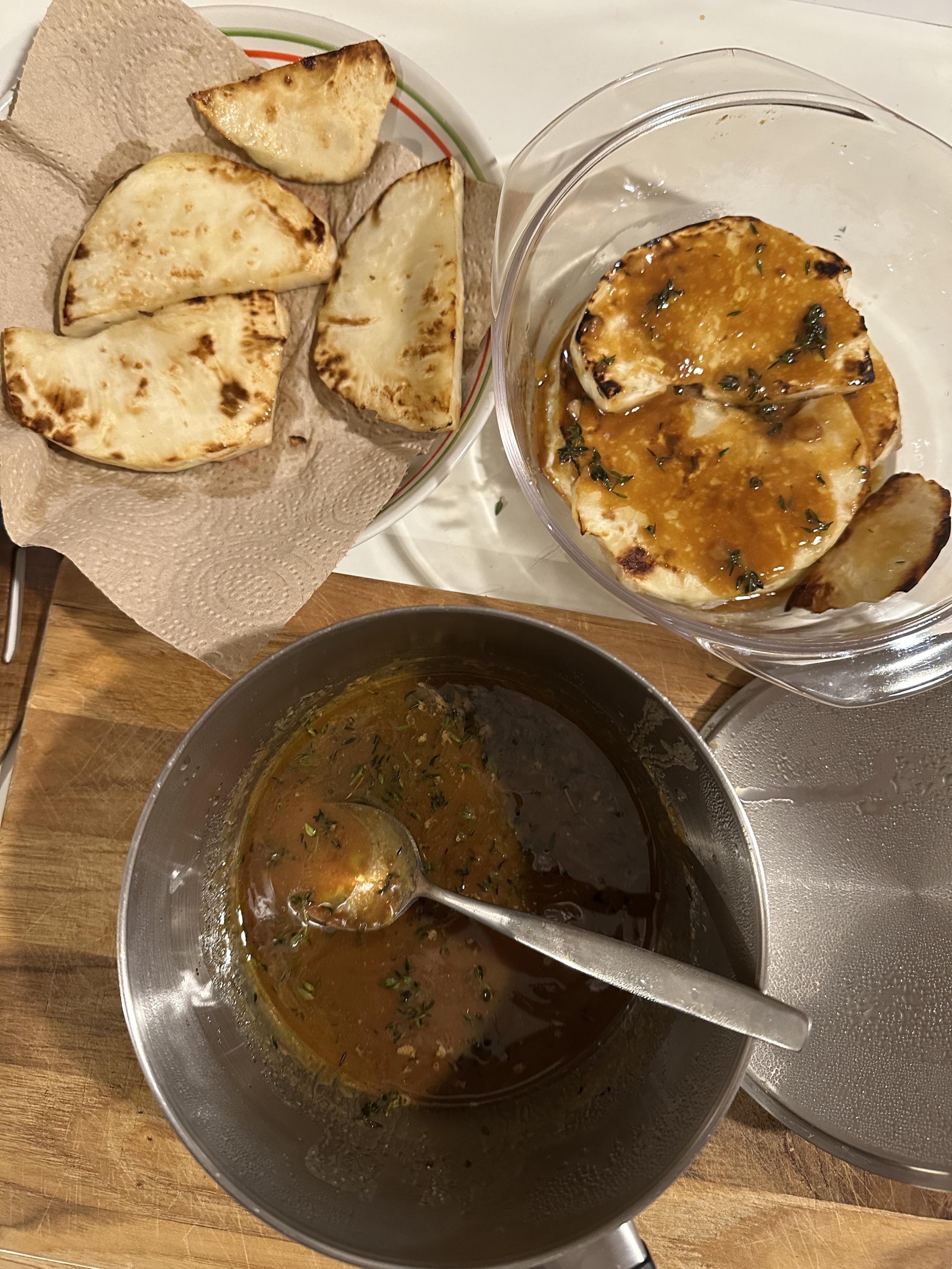 Pan-fried slices of celeriac draining in kitchen towel, then being transferred into an oven-safe dish and covered in a miso-butter-thyme-honey glaze.