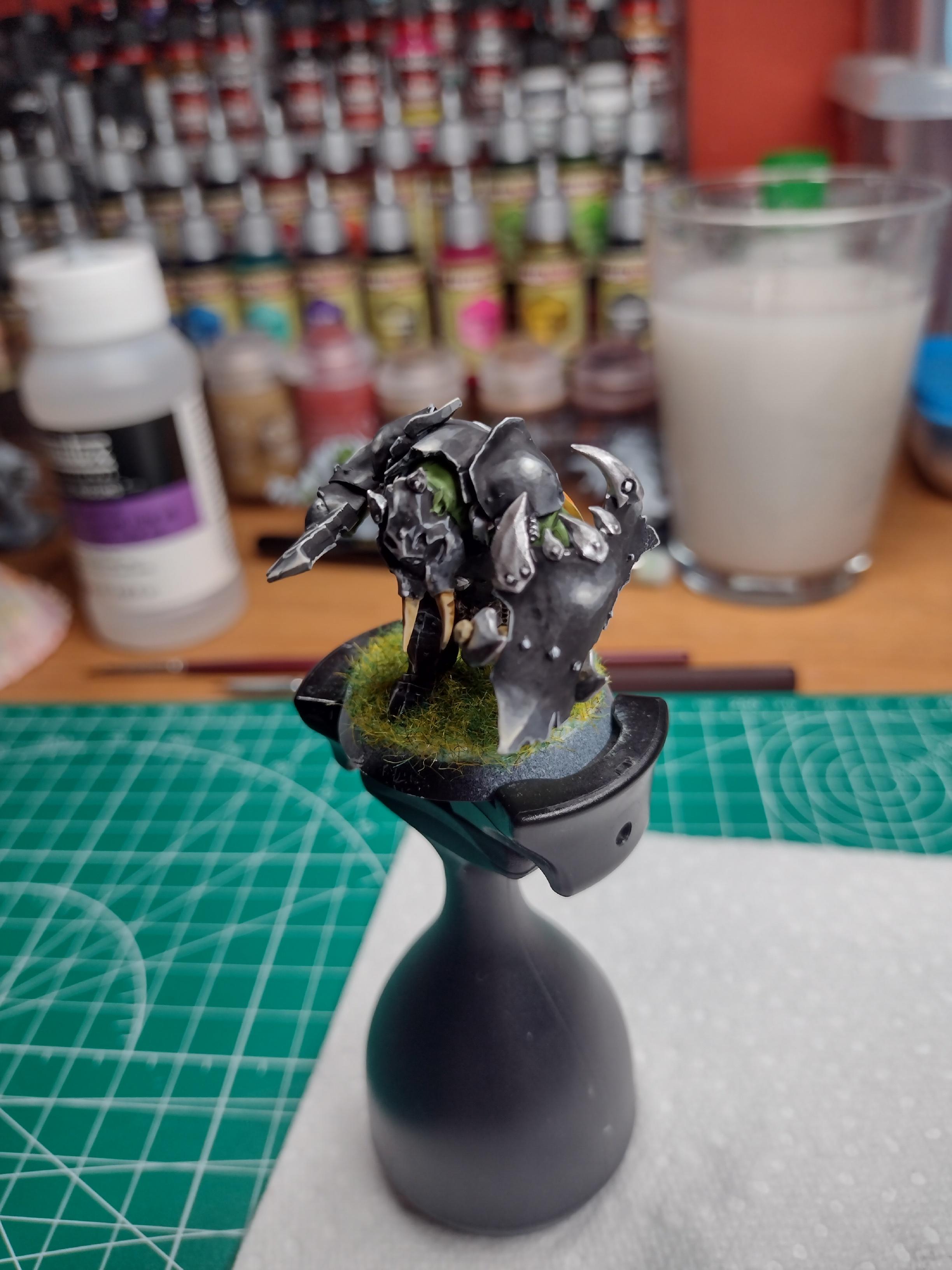 Orc miniature painted with a black armour.