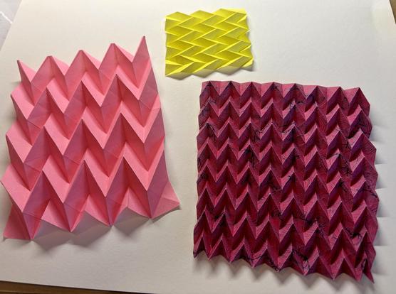 Several origami models of the Miura-ori fold.