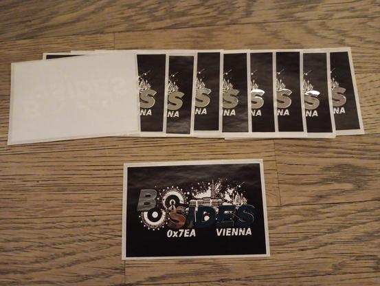8 BSides Vienna Stickers where only the 'na' is visible and one fully visible one below