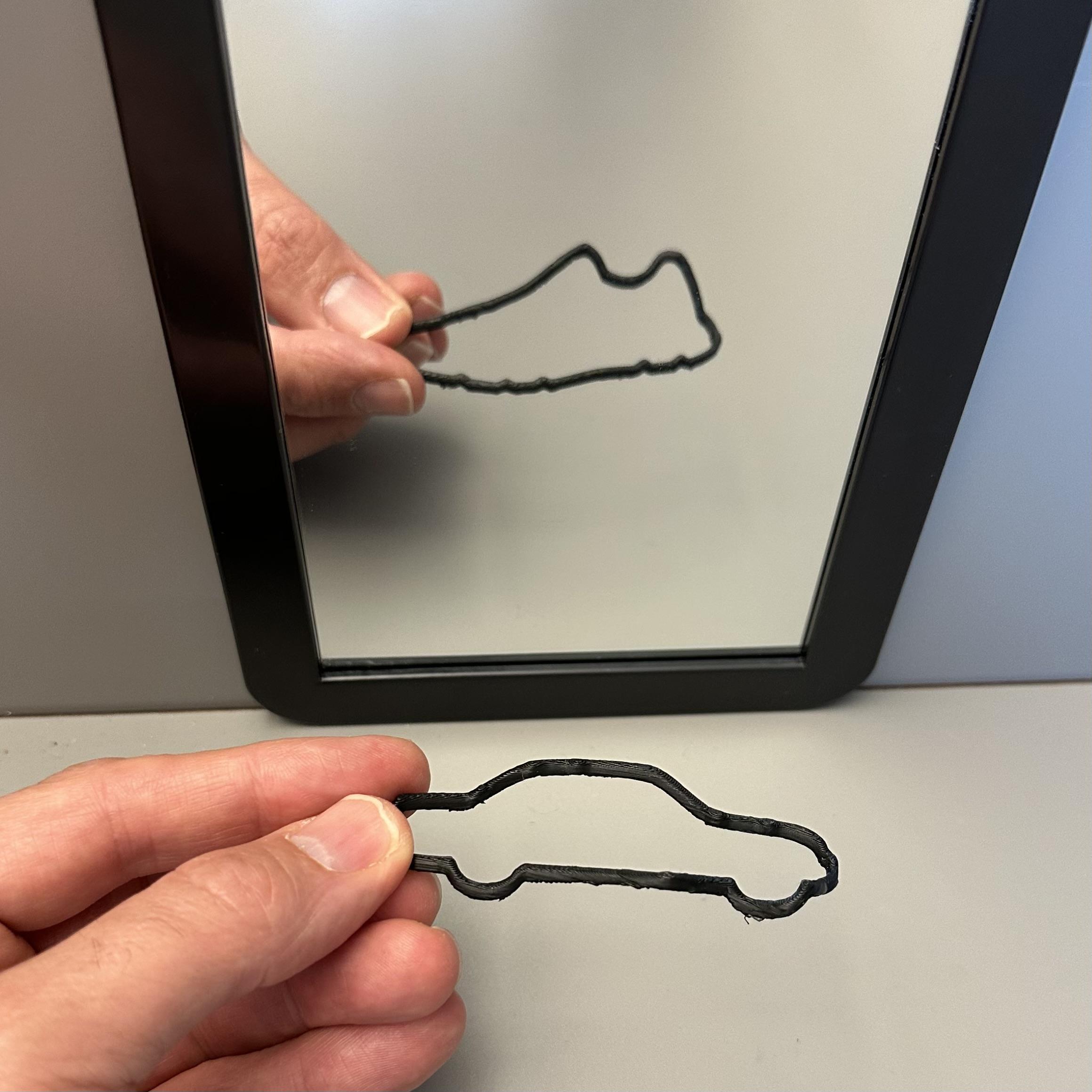 A car that has a sneaker-shaped reflection