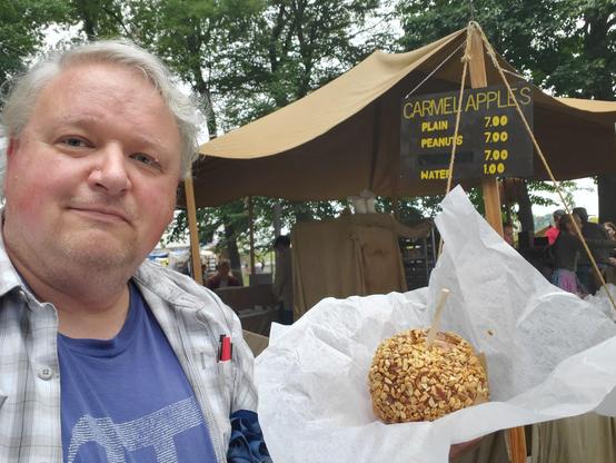 It rained most of the day but was OK right then and no long lines.  Caramel apple with peanuts!
